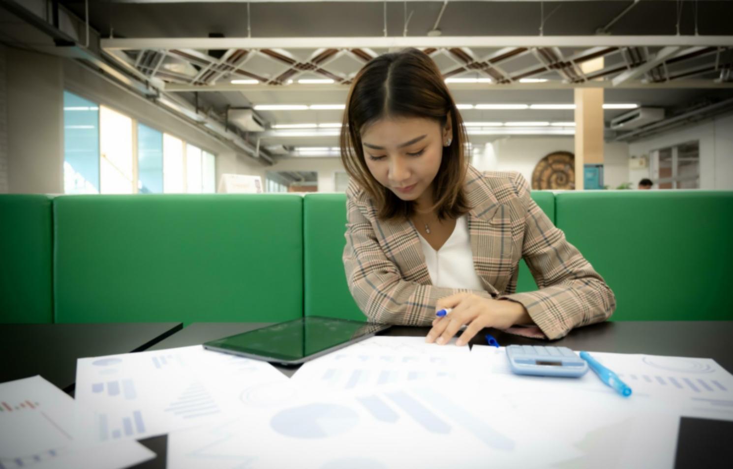 Students engaged in investment analysis session